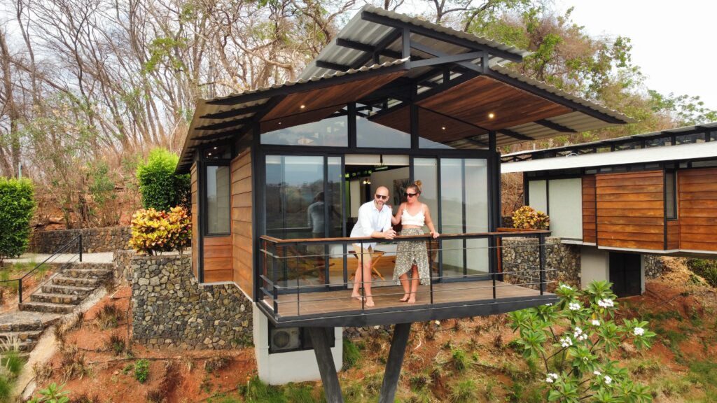 Couple relaxing on a private suite terrace at Pacific Kalokairi in Tamarindo
